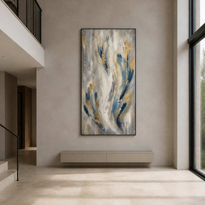 Slender blue abstract wall art displayed in a double-height modern entryway.