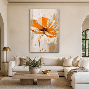 Frameless orange floral painting above a cream sectional sofa and pale wood coffee table.