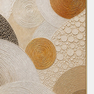 Close-up of the painted texture in layered circles in gold, brown, and ivory.