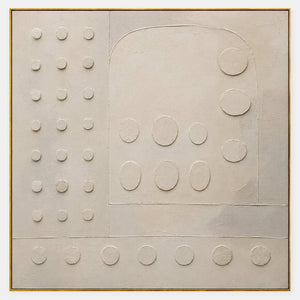 Warm white textured wall art with raised circles and quiet geometry.