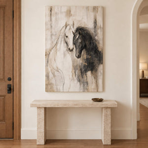 A white horse and a dark horse leaning close on an ivory ground without an outer frame, displayed above an entryway console.
