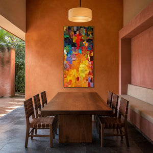 Vivid textured abstract wall art displayed in a warm modern dining room.