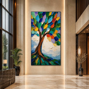 Vibrant textured tree painting displayed in a tall contemporary hotel lobby.