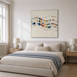Playful multicolor abstract wall art above a calm bedroom.
