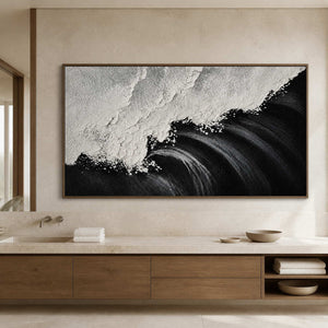 Wood framed wave painting with raised white foam above a bathroom vanity.