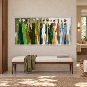 Days in Full Bloom in a white frame above a long cream bench with green and white towels beside a bathroom vanity.