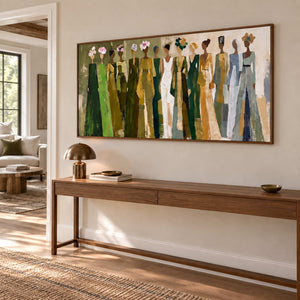 Days in Full Bloom in a wood frame above a long hallway console with books and a small brass lamp.