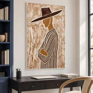 Folded-arm profile painting above a dark desk beside navy bookshelves.