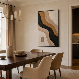Earth-tone textured abstract wall art in an elegant dining room with a black metal frame.