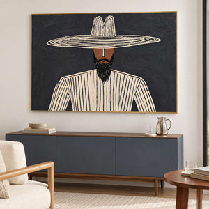 Bearded portrait above a blue-gray sideboard with a pitcher and stacked books.