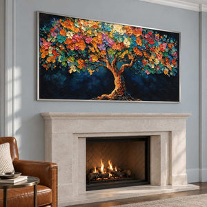 Multicolored tree artwork over a lit pale fireplace on a blue-gray wall.