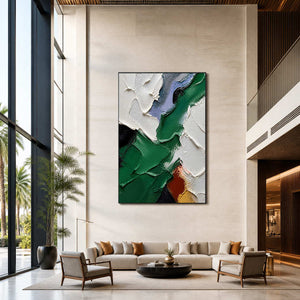 Vertical emerald abstract art displayed in a spacious contemporary hotel lobby.