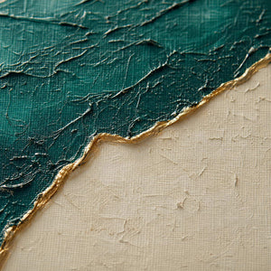 Close up of raised emerald and ivory paint divided by a metallic-gold ridge.