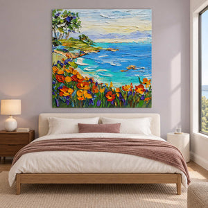 Turquoise bay painting above a bed against a pale lilac wall.