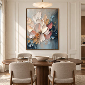 Vertical ivory, blush, and midnight-blue sculpted floral painting, displayed in a dining room in a brown wood frame.