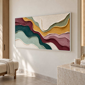 Wavy band painting beside a pale vanity and a cream bench with a draped towel.