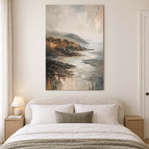 A rocky coast receding into soft gray mist without an outer frame, displayed above a bed.