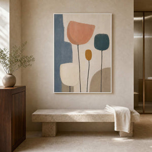 Soft botanical wall art in a warm hotel bathroom.