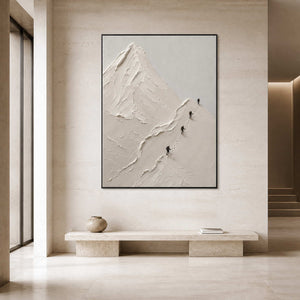 Minimalist mountain artwork displayed in a modern stone entryway.