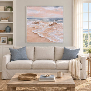 Free as the Sea in a white frame above a cream sofa with blue cushions and a pale wood coffee table.