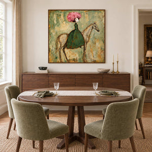 Gentle Company in a wood frame above a dark sideboard beside an oval dining table and green upholstered chairs.