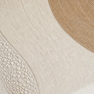 Close-up of the painted texture in gold arc rising through ivory curves.