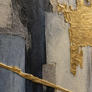 Close-up of raised gold, black, gray, and ivory abstract texture.