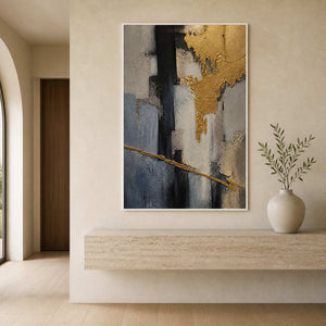 Vertical textured artwork displayed above a pale stone entryway console.