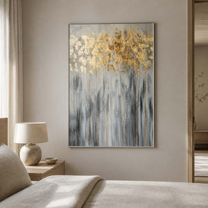 Textured gold and gray wall art displayed in a serene neutral bedroom.