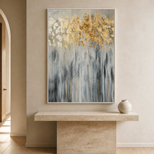 Vertical botanical artwork displayed above a sculptural stone entryway console.