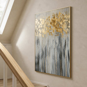 Gold and gray abstract botanical painting displayed beside a light wood stairway.