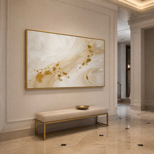 Gold and ivory abstract wall art displayed in an elegant luxury entryway.