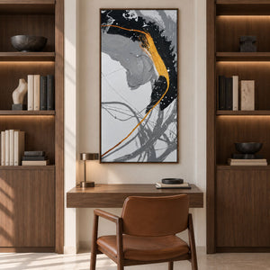 Artwork showing broad black and gray brush arcs crossed by a gold-colored line and white flecks in a study with a desk, with a brown wood-look frame.