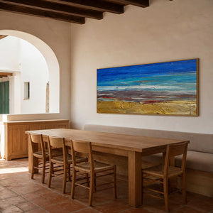 Blue and gold coastal wall art displayed in a warm dining room.