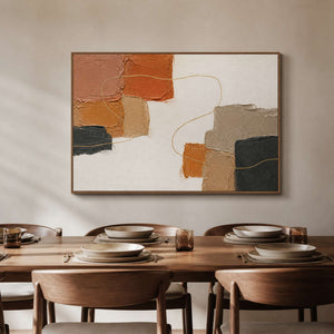 Warm textured abstract wall art displayed above a wood dining table.
