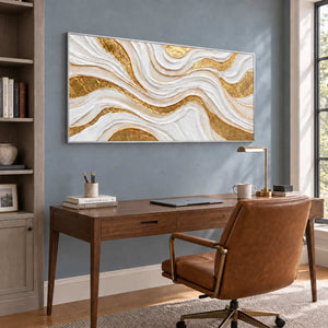 Golden Years in a silver frame above a wood desk and brown leather office chair against a blue-gray wall.
