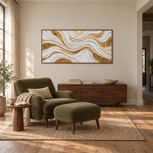 Golden Years in a wood frame above a low sideboard behind an olive armchair and matching footstool.