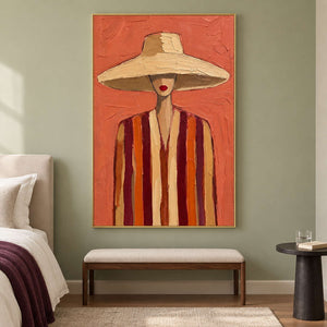 Cream-hat portrait above a beige bench on a green bedroom wall.