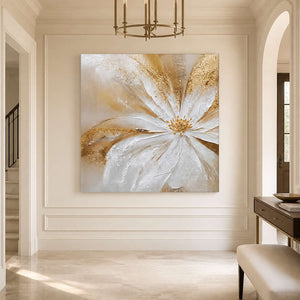 Frameless Grace in Bloom centered on a white paneled foyer wall beneath a brass chandelier.