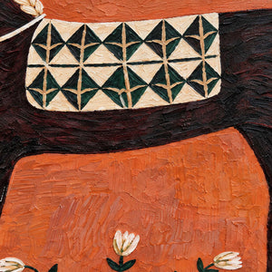 Detail of cream-and-green saddlecloth patterns and orange textured paint.
