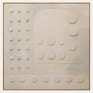 Warm white textured wall art with raised circles and quiet geometry.