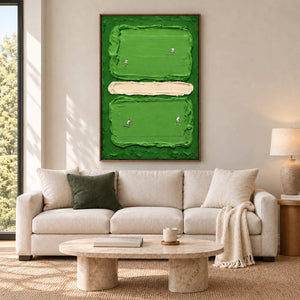 In the Swing in a wood frame above a cream sofa with a green cushion and a low oval stone table.