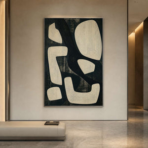 Large modern abstract wall art in a hotel lobby with a silver frame.