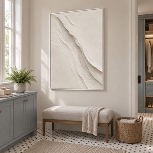 Hand-painted ivory abstract wall art with layered cream palette-knife relief, displayed in a bathroom dry area in a white frame.