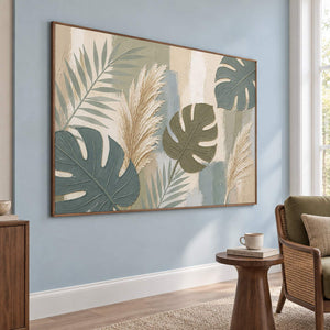 Sage leaves and ivory pampas grasses painting in a brown wood frame in a lounge.