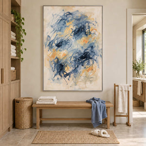 Let Your Thoughts Wander in a silver frame above a bench with blue and white towels in a bathroom dry area.