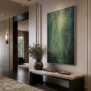 Vertical patina artwork in a dramatic residential entryway