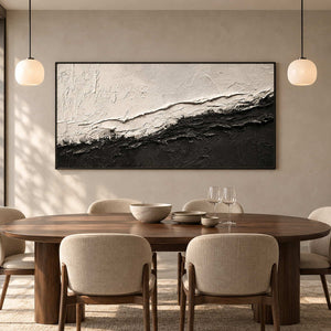 Diagonal monochrome abstract behind a wooden dining table beneath two globe pendant lights.