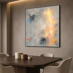 Blue-gray and gold abstract painting displayed in a refined dining room.