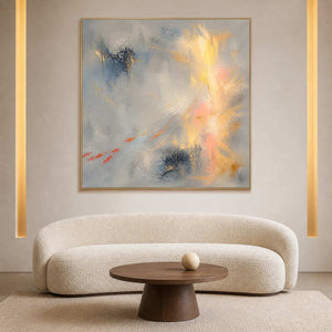 Gold and blush abstract painting styled in a quiet hotel lounge.